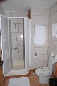 a bathroom with a shower and a toilet at Marmaris Park Hotel in Marmaris