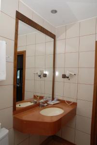 a bathroom with a sink and a mirror at Marmaris Park Hotel in Marmaris