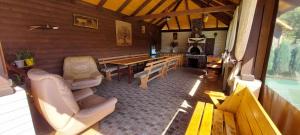 a living room with a table and a dining room at Сімейний котедж У Діани in Tatariv