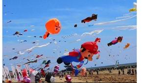 a bunch of kites flying in the sky on a beach at tente pour 2 personnes in Saint-Jean-de-Monts