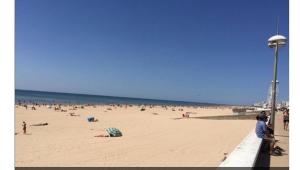 a large group of people on a beach at tente pour 2 personnes in Saint-Jean-de-Monts