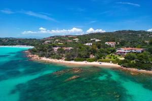 an aerial view of a beach in the ocean at Baia Dorata beach apartments in Porto Istana