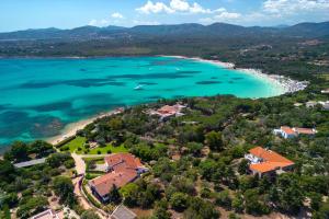 an aerial view of a resort and a beach at Baia Dorata beach apartments in Porto Istana