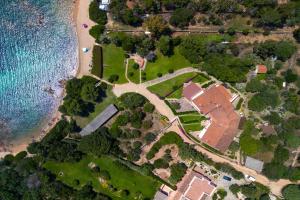 an aerial view of a park next to a beach at Baia Dorata beach apartments in Porto Istana