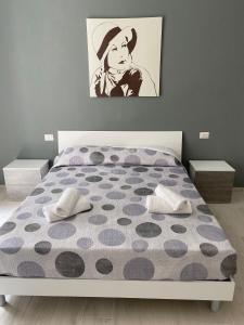 a bedroom with a bed with a polka dot mattress at La Dolce Vita in Camerota