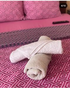 a stuffed towel animal laying on a bed at Guest House Zarnovel Palace in Ohrid