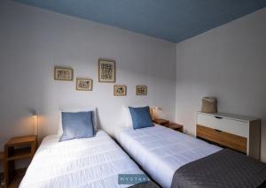 Ένα ή περισσότερα κρεβάτια σε δωμάτιο στο MyStay - Casa Sol Nascente