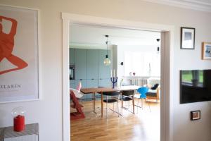 a dining room and living room with a table and chairs at 2bedroom apartment close to centre in Reykjavík