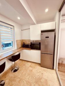 Kuchyň nebo kuchyňský kout v ubytování Avangarde Apartment