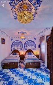 Ліжко або ліжка в номері Casa Meftah Blue