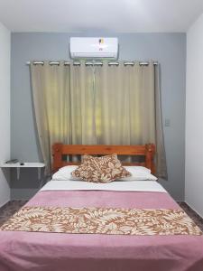 Säng eller sängar i ett rum på Pouso Tião da Morena