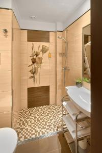 a bathroom with a sink and a shower at Hotel Tetřeví Boudy in Pec pod Sněžkou