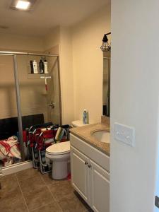 a bathroom with a toilet and a sink at Hampton Beach OCEAN FRONT Condo at the Surf in Hampton