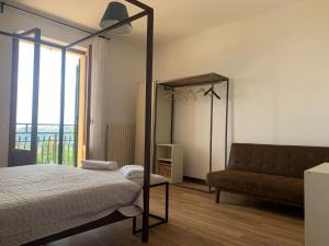 Postel nebo postele na pokoji v ubytování La Collina di Emma