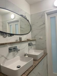 a bathroom with a white sink and a mirror at B&B Le Rocce in Castel San Giorgio +79 photos
