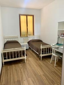 Postel nebo postele na pokoji v ubytování La Collina di Emma