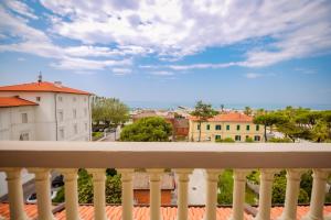 a balcony with a view of a city at Hotel Belvedere in Forte dei Marmi