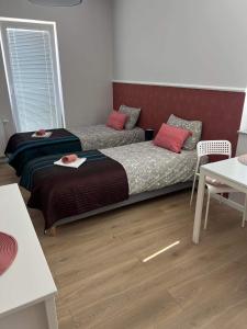 Łóżko lub łóżka w pokoju w obiekcie Chcę tu zostać Apartamenty Gdynia