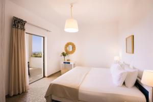 Ένα ή περισσότερα κρεβάτια σε δωμάτιο στο Villa Stella Suites