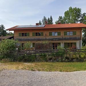 a house with solar panels on top of it at Ferienwohnung Morgenrot in Pfronten