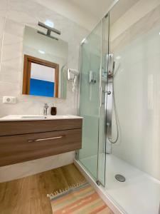 a bathroom with a glass shower and a sink at Venice Mestre Station House in Mestre