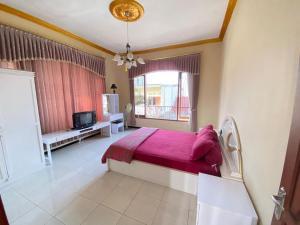 Ένα ή περισσότερα κρεβάτια σε δωμάτιο στο NN Homestay