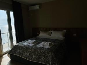 Voodi või voodid majutusasutuse CoastAL Hotel Shengjin toas