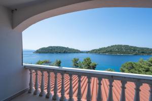 a balcony with a view of the water at Panoramic Apartments Anić in Blato