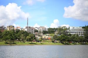 a view of a city with a body of water at FLORA HOME DALAT in Da Lat