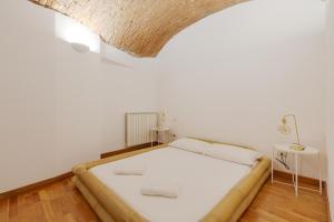 Postel nebo postele na pokoji v ubytování Sant'Ambrogio Design Apartment