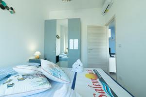 A bed or beds in a room at Appartamenti Craulo