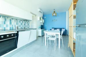 A kitchen or kitchenette at Appartamenti Craulo