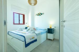 A bed or beds in a room at Appartamenti Craulo