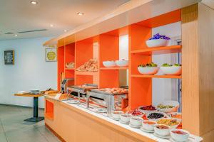 a kitchen with lots of food on shelves at Premiere Classe Casablanca Centre Ville in Casablanca