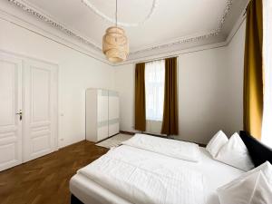 Postel nebo postele na pokoji v ubytování Boutique Hotel Columbia