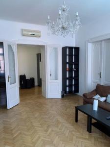 a living room with a couch and a table at AIR-CONDITIONED LARGE APARTMENT in Vienna