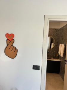 a door with a heart and a peace sign on it at Cora May Central Villa with private pool 200m to the beach in Faliraki