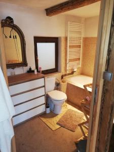 a bathroom with a toilet and a sink and a tub at Chata z Widokiem in Międzybrodzie Bialskie