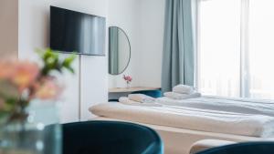 Posteľ alebo postele v izbe v ubytovaní Marienhof Apartments