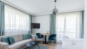 Televízia a/alebo spoločenská miestnosť v ubytovaní Marienhof Apartments