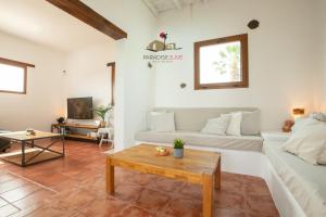 a living room with a couch and a table at Villa Luz in Lajares