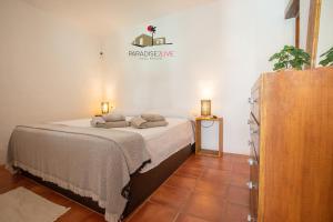 a bedroom with a bed in a room at Villa Luz in Lajares +27 photos
