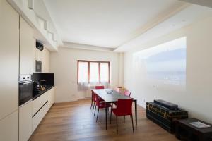 a kitchen and dining room with a table and chairs at - ROMAN RUINS HOUSE - 750m from the metro station in Rome