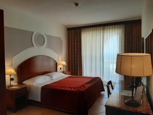 Cama ou camas em um quarto em Parco dei Principi Hotel