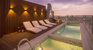 a pool on the rooftop of a building at lovely apartament with hydromassage in Lima