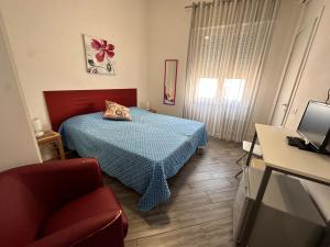 Postel nebo postele na pokoji v ubytování Dafne Marsala Centro