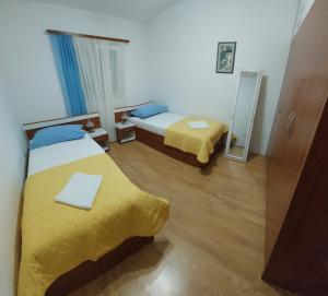 Postel nebo postele na pokoji v ubytování Apartman Igor