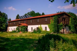 a barn with a roof with a solar at Gościniec Zagaje in Zagaje