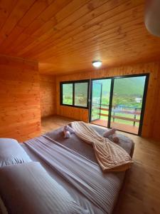 Tempat tidur dalam kamar di Driti GH Nderlysa