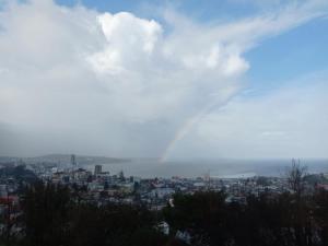 una vista de una ciudad con un arco iris en el cielo en Patagonia Nice View, en Puerto Montt